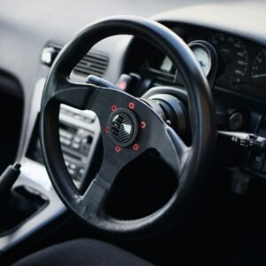 black steering wheel in close up photography