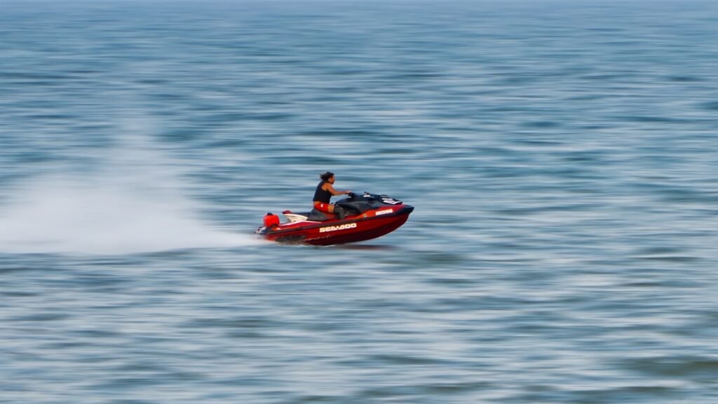 A man riding a jet ski on top of a body of water